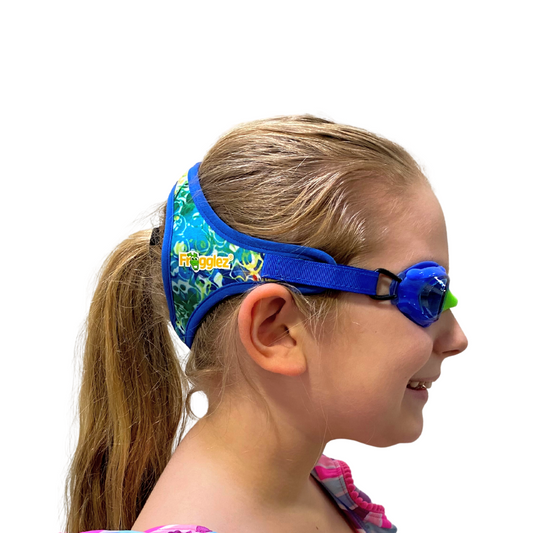 Blue wavez pattern patterned swimming goggles on white background