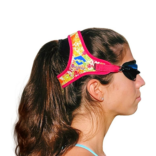 woman wearing pink and orange masters swim goggles by Frogglez swim goggles for teens and adults