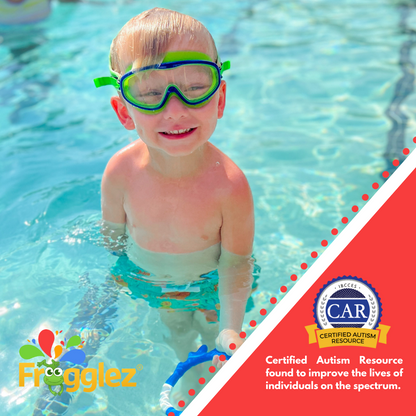 Blond child smiling at camera standing in pool with Frogglez Green Navigatorz mask ono  Text reads: Certified Autism Resource found to improve the lives of individuals on the spectrum. 