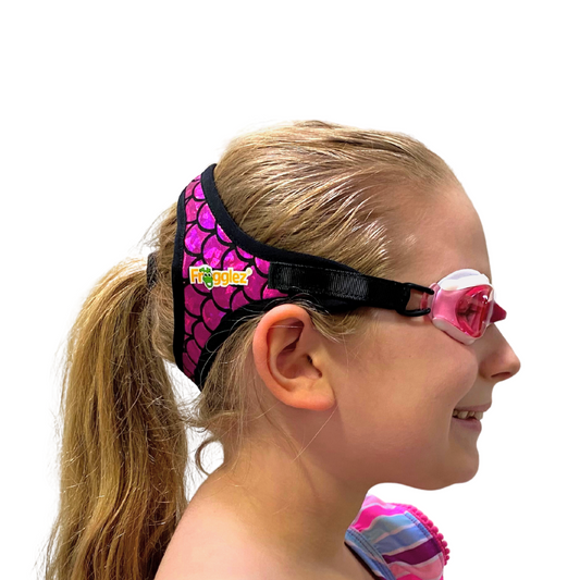 Pink Mermaidz scale pattern patterned swimming goggles on white background