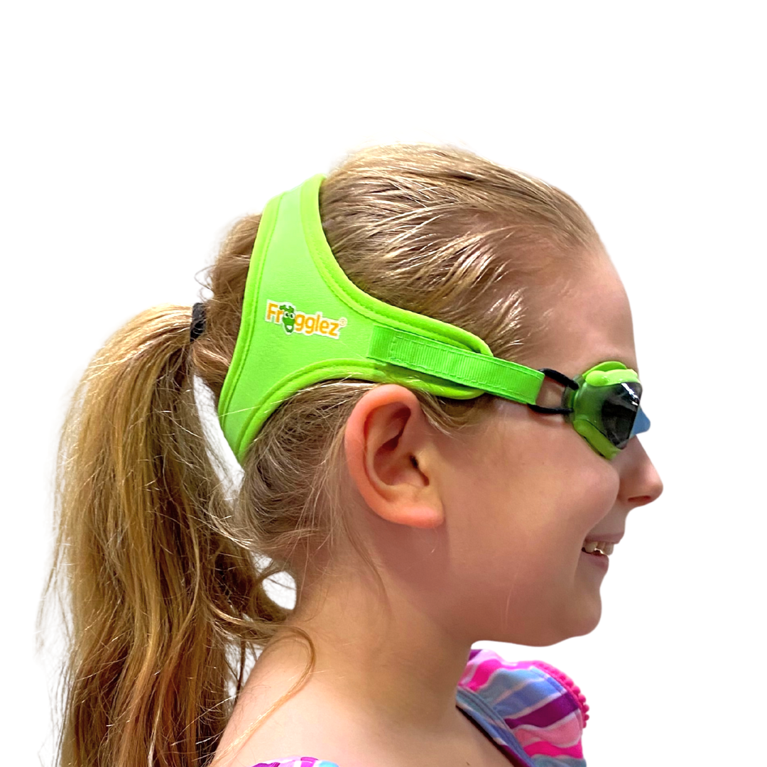 Solid Green kids swimming goggles on white background