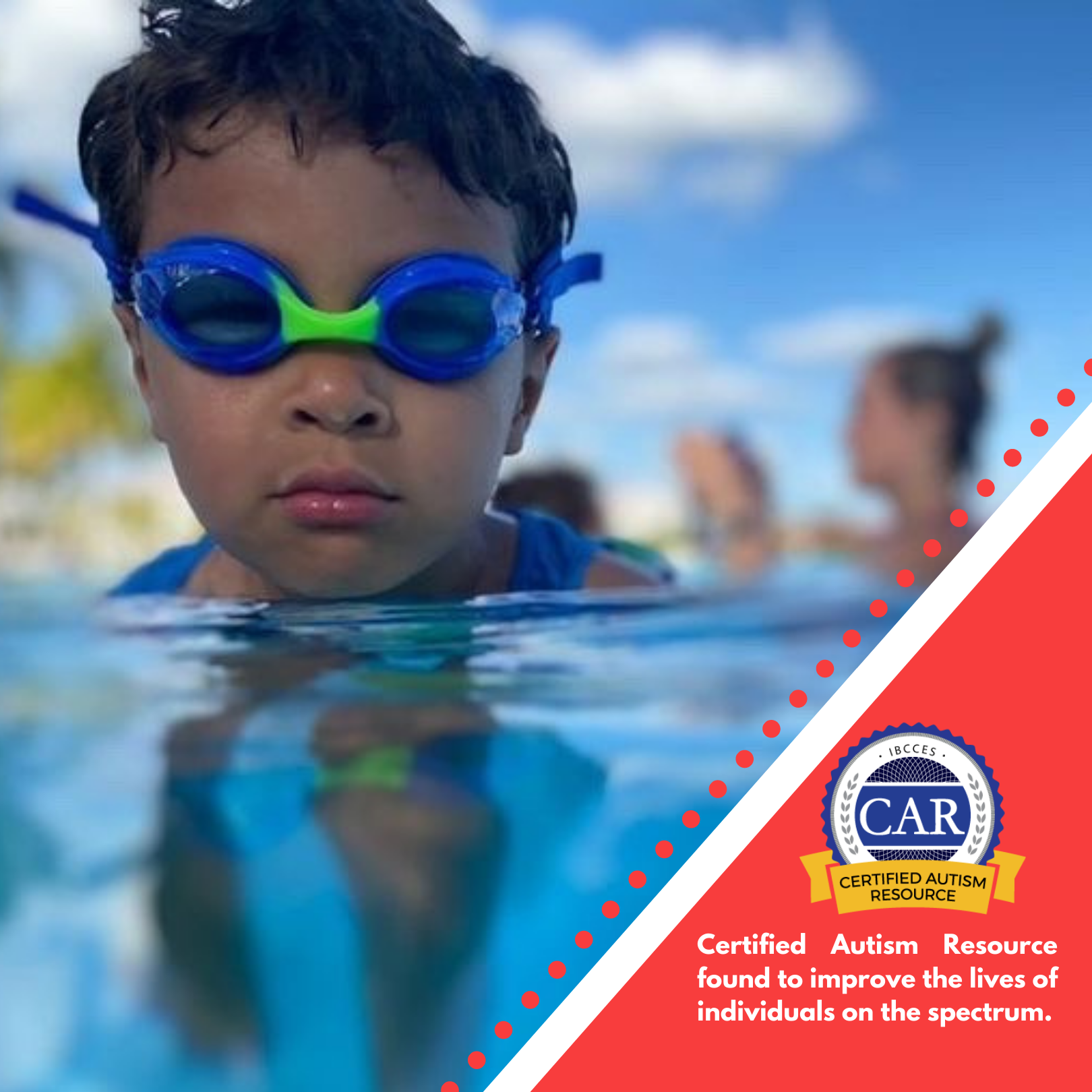 Young boy with dark hair wearing blue Frogglez swim goggles raises his head out of a swimming pool and looks directly at the camera. Behind him is a blurred image of adults. Text reads: Certified Autism Resource found to improve the lives of individuals on the spectrum.
