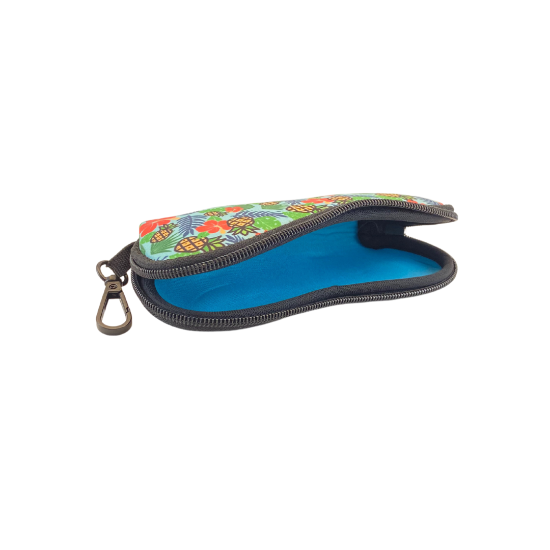 Frogglez goggles neoprene swim goggle case with Elvis Burrows Hawaiian patterns. Perfect pouch to store Frogglez Goggles. Made from durable neoprene. Sturdy zipper stands up to harsh pool environments. Lightweight at 2 oz, easily attach to your swim bag or backpack. Measures 7.25" long x 3.25" wide. Machine washable.